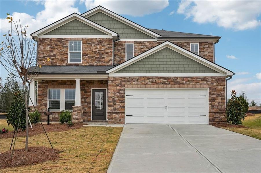 Front exterior of a new home in Harmony Manor, Fairburn, GA, highlighting curb appeal (Image 1).