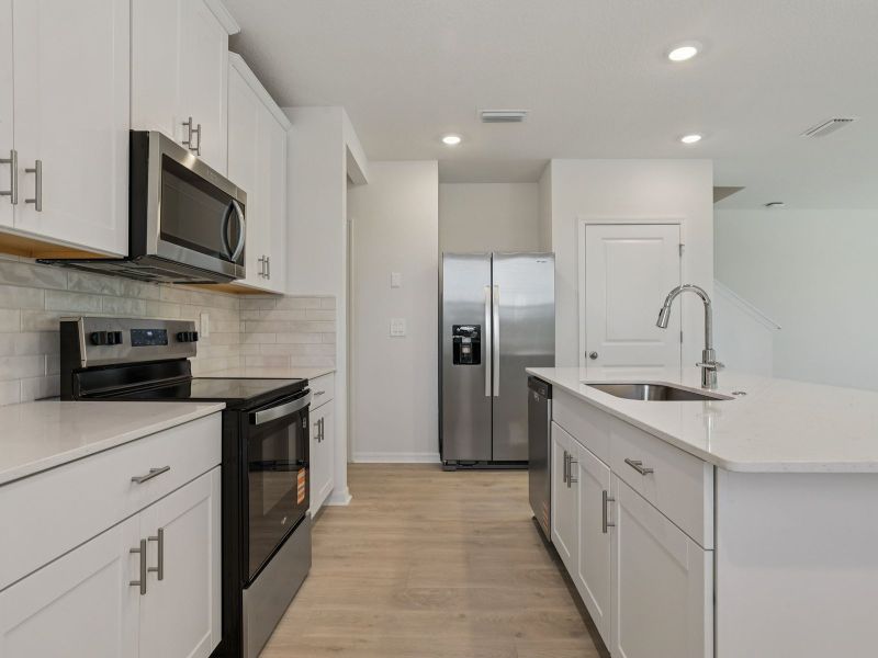 Furnished interior view inside a new home in Bradford Park, Ormond Beach (Image 5).