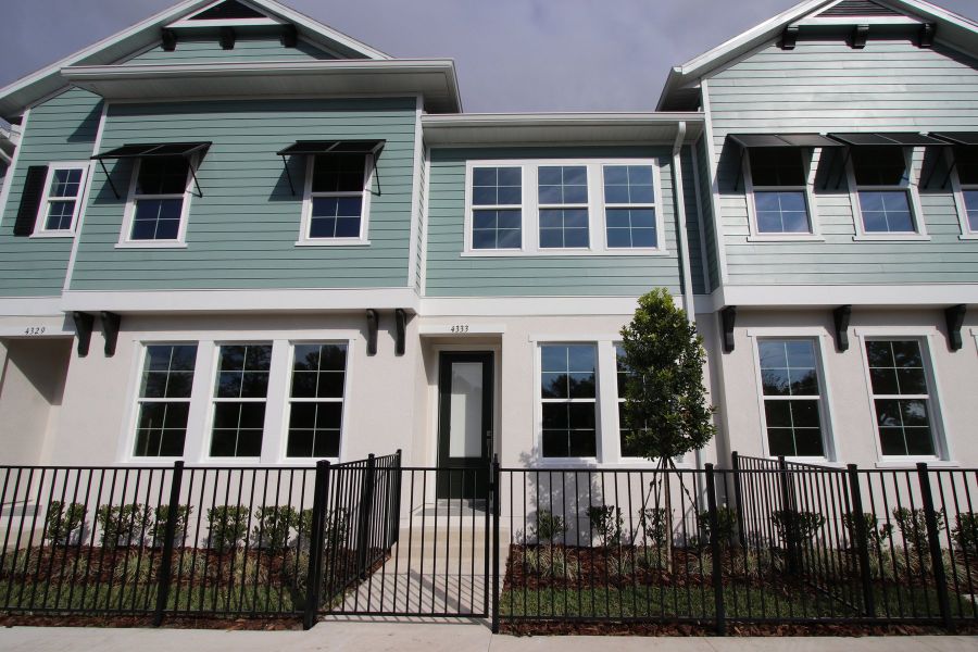 Front exterior of a new home in Baldwin Crossing 16', Orlando, FL, highlighting curb appeal (Image 25).