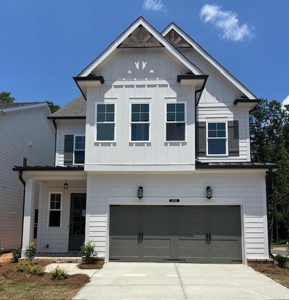 Front exterior of a new home in Palisades Single Family, Cumming, GA, highlighting curb appeal (Image 24). Front exterior of a new home in Palisades Single Family, Cumming, GA, highlighting curb appeal (Image 24).