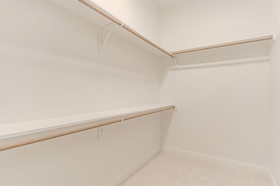Onwer's closet with double rods and shelves
