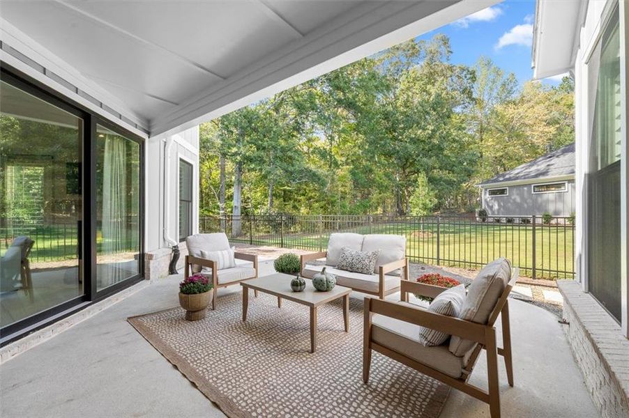 Exterior details and patio area of a home in The Courtyards by The Manor, Alpharetta (Image 27). Exterior details and patio area of a home in The Courtyards by The Manor, Alpharetta (Image 27).