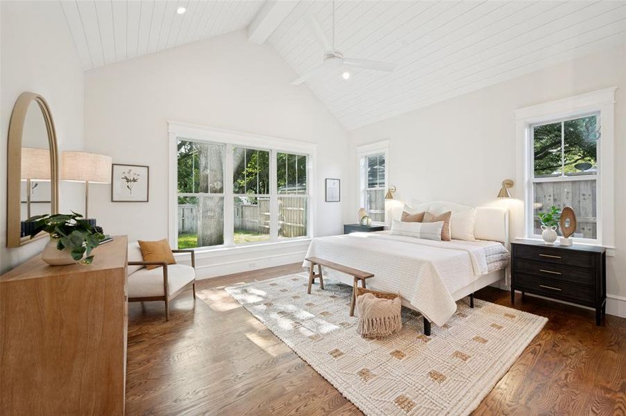 Vaulted shiplap ceiling featuring an integrated ceiling fan