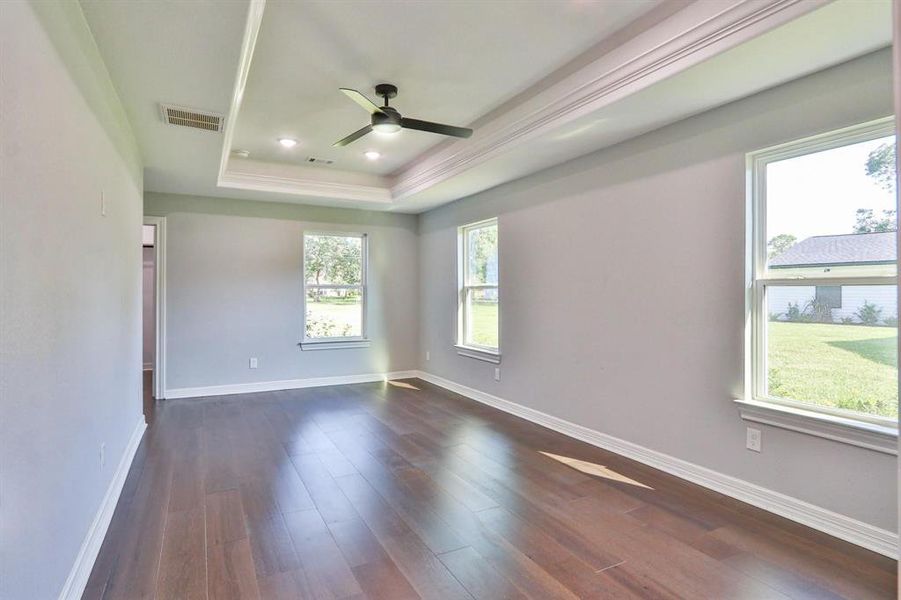 Space, Comfort and Tranquil Views. Another look at the gorgeous primary bedroom on the first level.