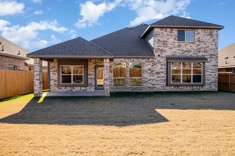 Exterior details and patio area of a home in Mustang Place II, Heartland (Image 4).