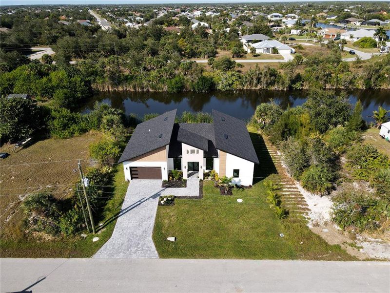 Front exterior of a new home in , Port Charlotte, FL, highlighting curb appeal (Image 27). Front exterior of a new home in , Port Charlotte, FL, highlighting curb appeal (Image 27).