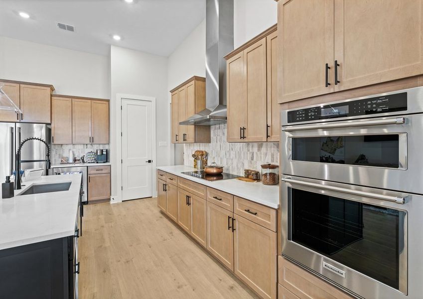The kitchen has sprawling granite countertops.