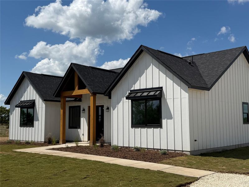 Front exterior of a new home in , Dale, TX, highlighting curb appeal (Image 1). Front exterior of a new home in , Dale, TX, highlighting curb appeal (Image 1).