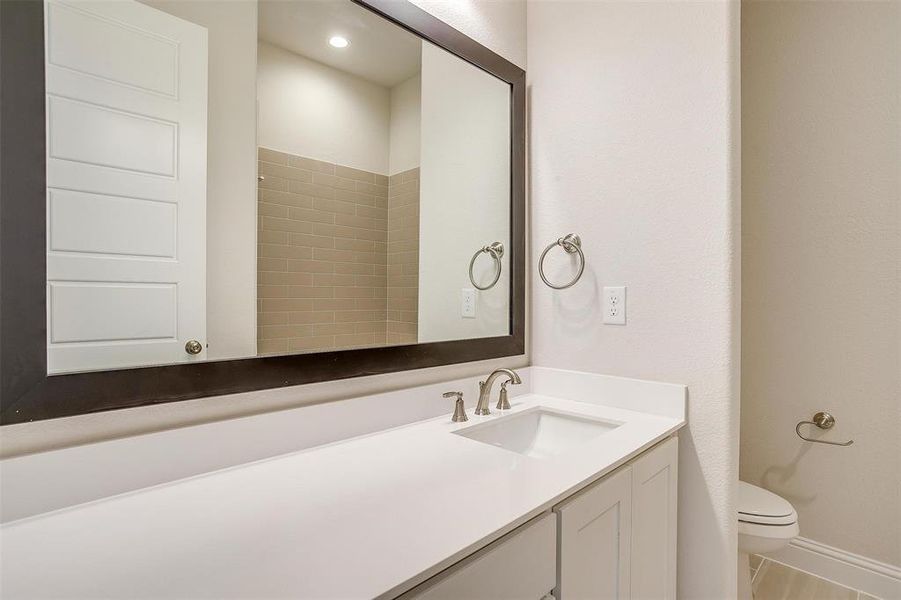 Bathroom with vanity and toilet