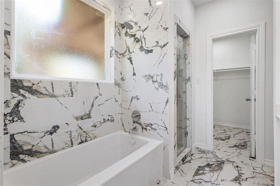 Bath tub and marble style tile finishings Bath tub and marble style tile finishings