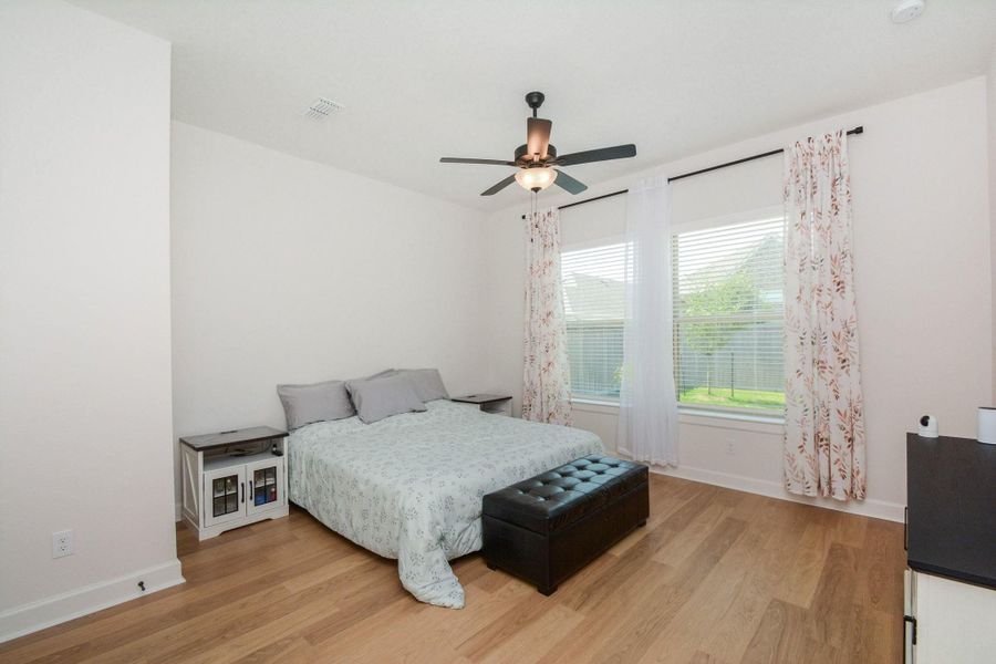 Primary Bedroom: The first-floor primary bedroom provides a comfortable retreat with ample space for a king-size bed, a sitting area, or additional furnishings. Bright, inviting, and designed for everyday comfort, this space offers the perfect balance of privacy and relaxation.