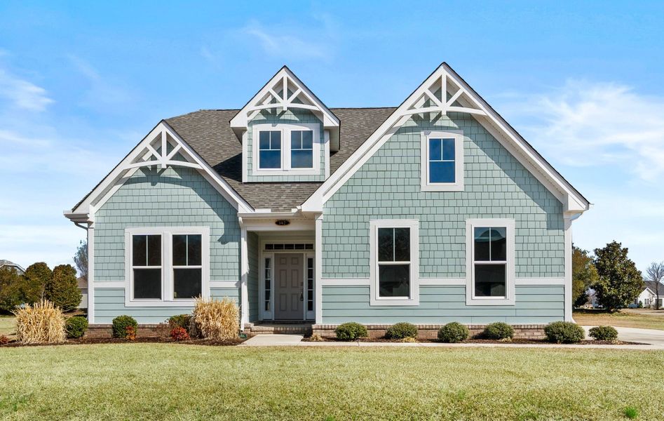 Front exterior of a new home in Belmont at Albemarle, Hertford, NC, highlighting curb appeal (Image 1). Front exterior of a new home in Belmont at Albemarle, Hertford, NC, highlighting curb appeal (Image 1).