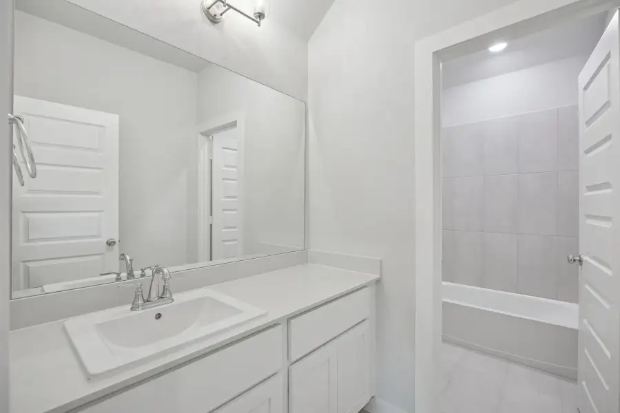 Bathroom in the Masters home plan by Trophy Signature Homes – REPRESENTATIVE PHOTO