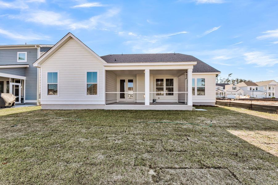 Exterior details and patio area of a home in Tidewater at Lakes of Cane Bay, Summerville (Image 17).