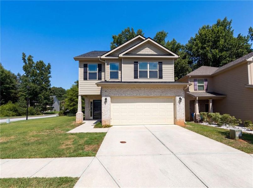 Front exterior of a new home in , Hampton, GA, highlighting curb appeal (Image 1). Front exterior of a new home in , Hampton, GA, highlighting curb appeal (Image 1).