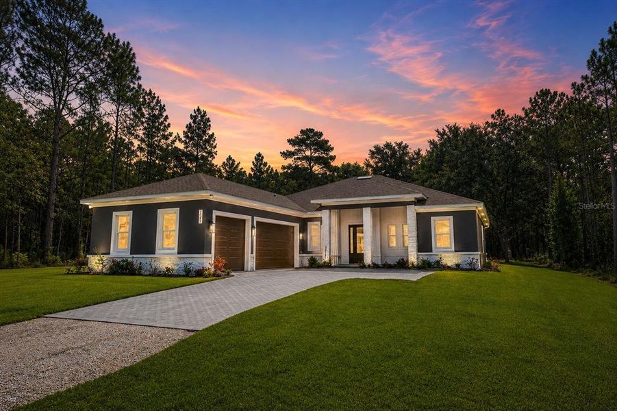 Front exterior of a new home in , Weeki Wachee, FL, highlighting curb appeal (Image 35).