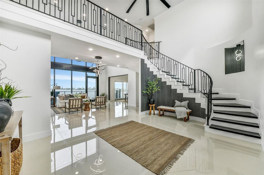 The staircase adds architectural interest while keeping the space open and airy. It’s both functional and striking.