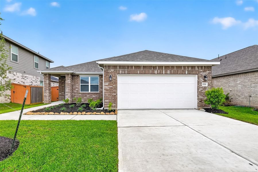 Front exterior of a new home in Cypress Green, Hockley, TX, highlighting curb appeal (Image 23). Front exterior of a new home in Cypress Green, Hockley, TX, highlighting curb appeal (Image 23).