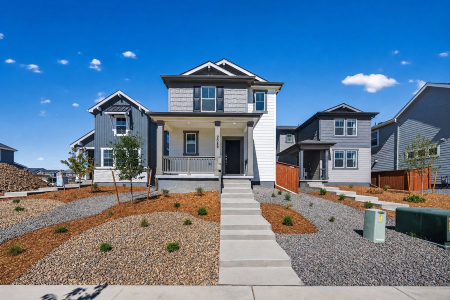 Front exterior of a new home in Farmlore, Brighton, CO, highlighting curb appeal (Image 1). Front exterior of a new home in Farmlore, Brighton, CO, highlighting curb appeal (Image 1).