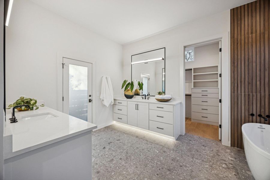Prime Suite Features - Gorgeous walk in shower, soaking tub, double vanities, terrazo tile, and 2 owner walk in closets!
