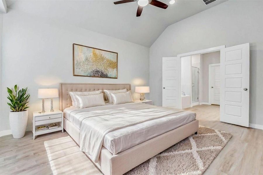 Primary Bedroom with En-Suite Bath. This photo has been virtually staged Primary Bedroom with En-Suite Bath. This photo has been virtually staged