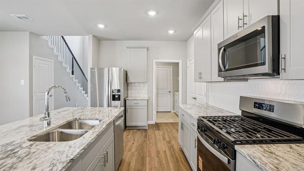 Photo is not of the actual home, but is an inspirational photo of builder’s model home and may depict options, furnishings, and/or decorator features that are not included.