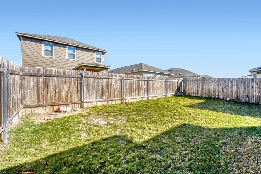 View of fenced backyard