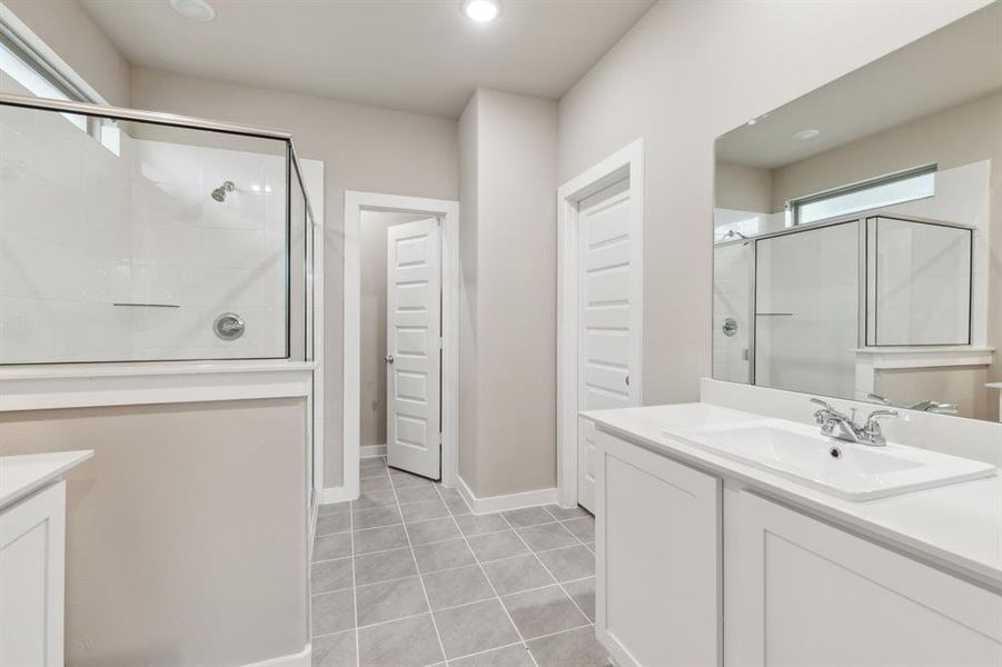 Primary bathroom in the Elm home plan by Trophy Signature Homes – REPRESENTATIVE PHOTO