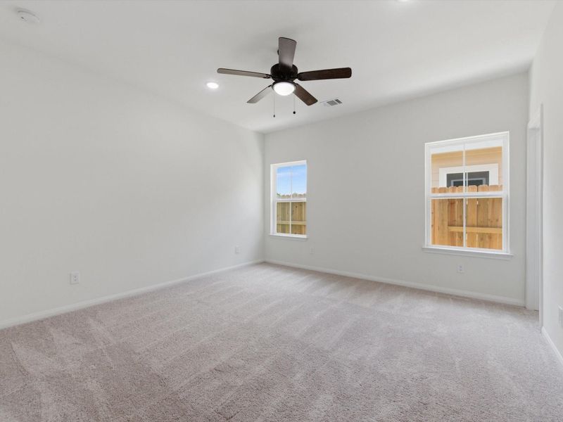 Conveniently located downstairs, the spacious primary suite offers a peaceful retreat with privacy, comfort, and easy access to the main living spaces. Conveniently located downstairs, the spacious primary suite offers a peaceful retreat with privacy, comfort, and easy access to the main living spaces.