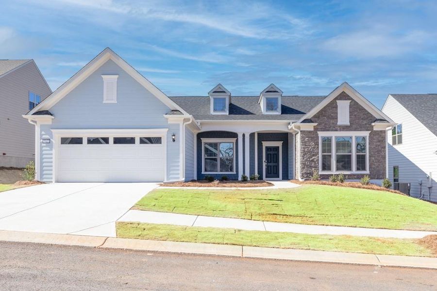 Front exterior of a new home in Del Webb Chateau Elan, Hoschton, GA, highlighting curb appeal (Image 20).