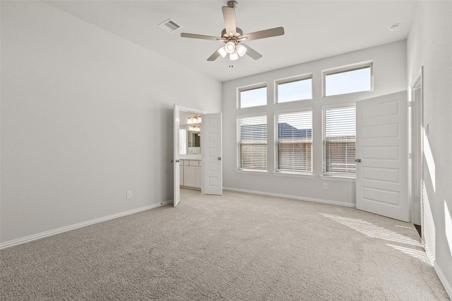 Spacious, unfurnished interior of a new home in Sunterra, Katy (Image 24).