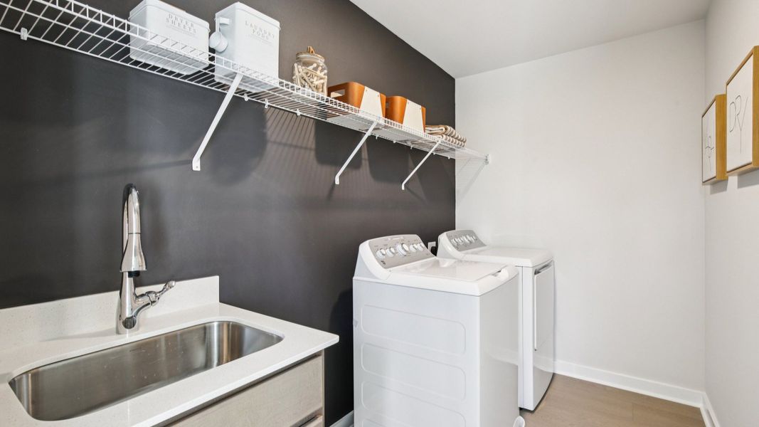 Laundry appliances and included sink for rinsing laundry