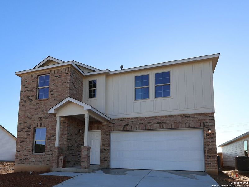 Front exterior of a new home in Agave, San Antonio, TX, highlighting curb appeal (Image 2).