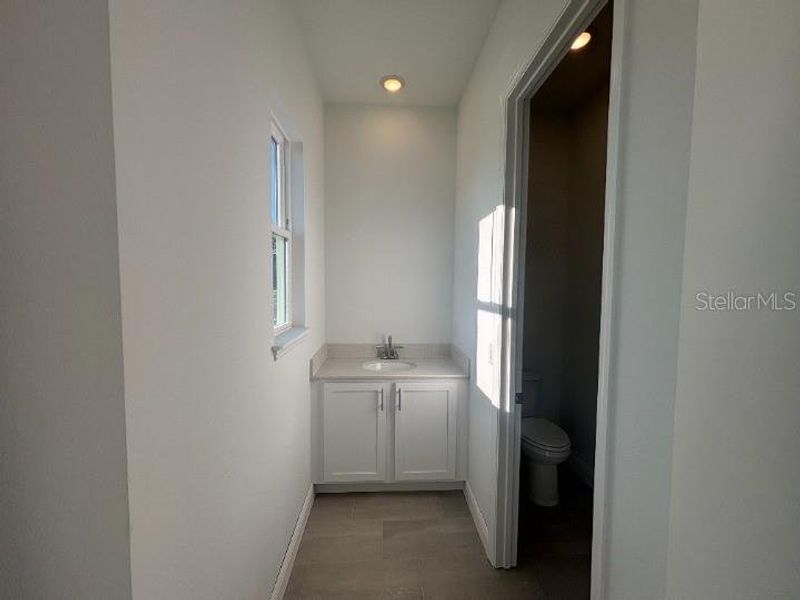 Furnished interior view inside a new home in Ardisia Park Estate, New Smyrna Beach (Image 7).