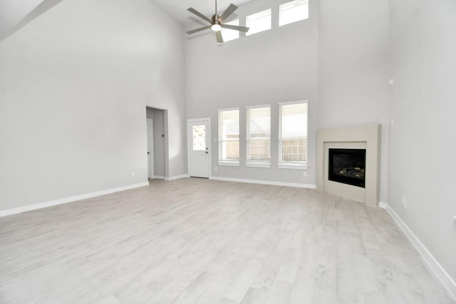 Discover another perspective of the heart of the house! Sample photo of completed home with similar floor plan. Actual colors and selections may vary.