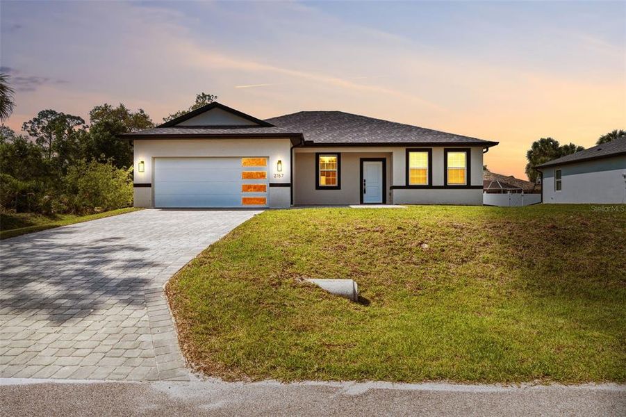Front exterior of a new home in , North Port, FL, highlighting curb appeal (Image 21).