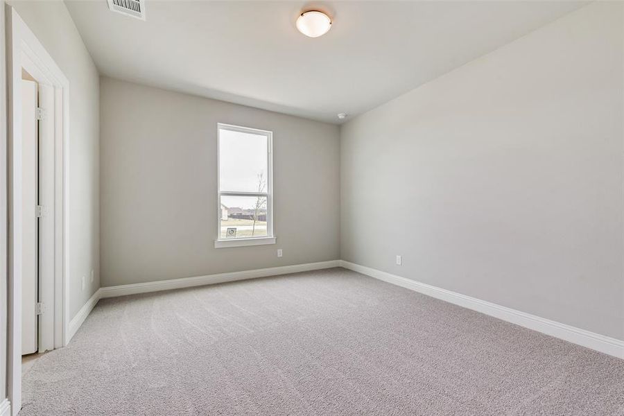 Spare room with light carpet