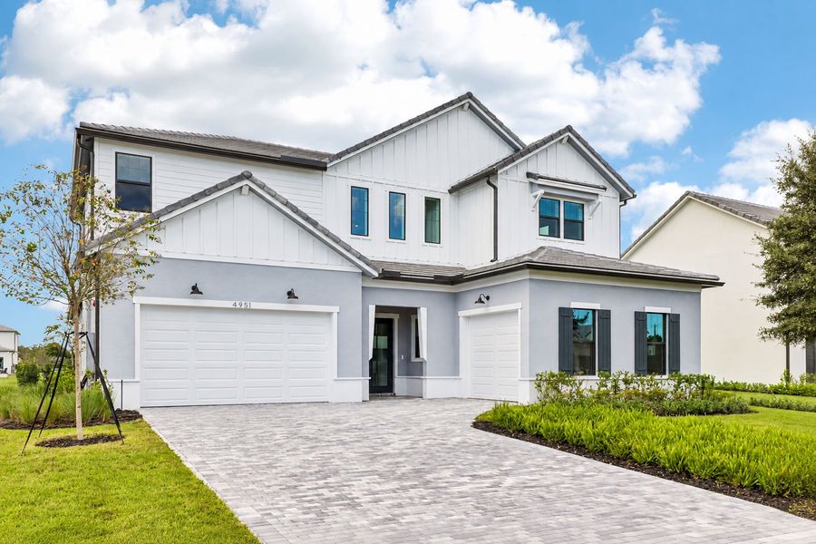 Front exterior of a new home in Marigold, Davie, FL, highlighting curb appeal (Image 24). Front exterior of a new home in Marigold, Davie, FL, highlighting curb appeal (Image 24).