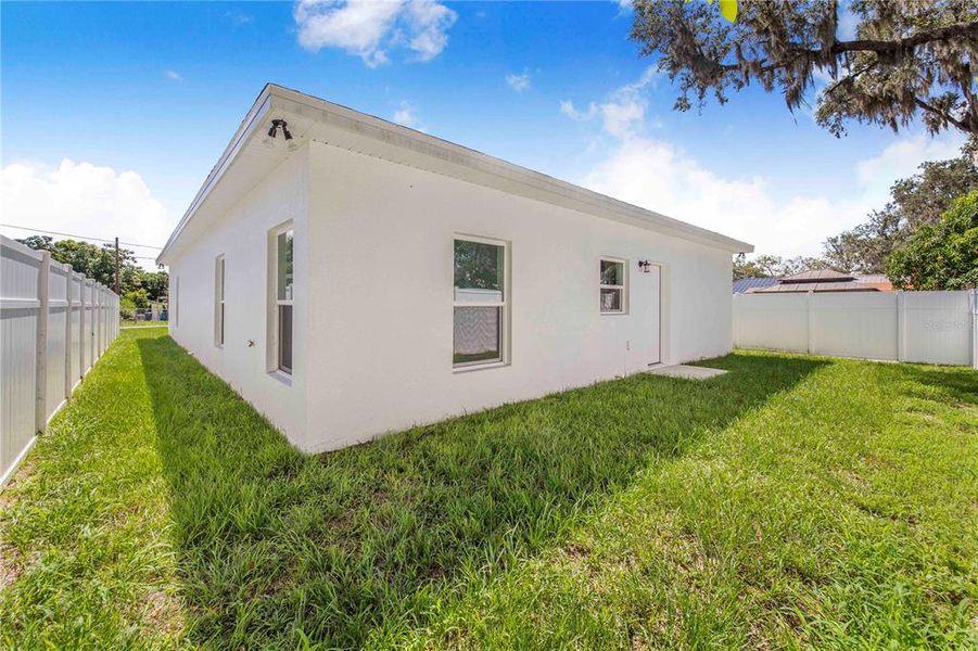 Front exterior of a new home in , Haines City, FL, highlighting curb appeal (Image 19).