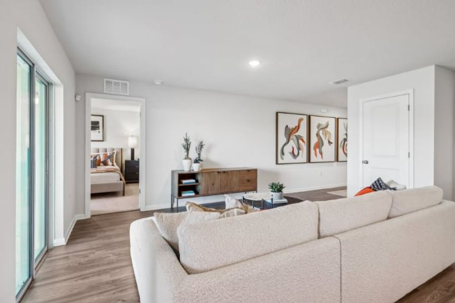 A living room with a couch and a table.