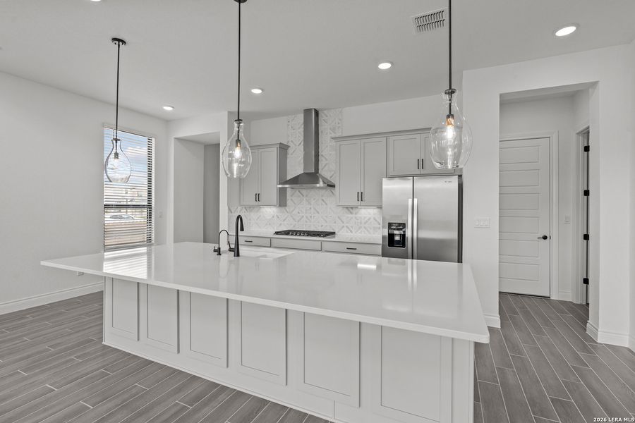 Furnished interior view inside a new home in Bison Ridge, San Antonio (Image 28).