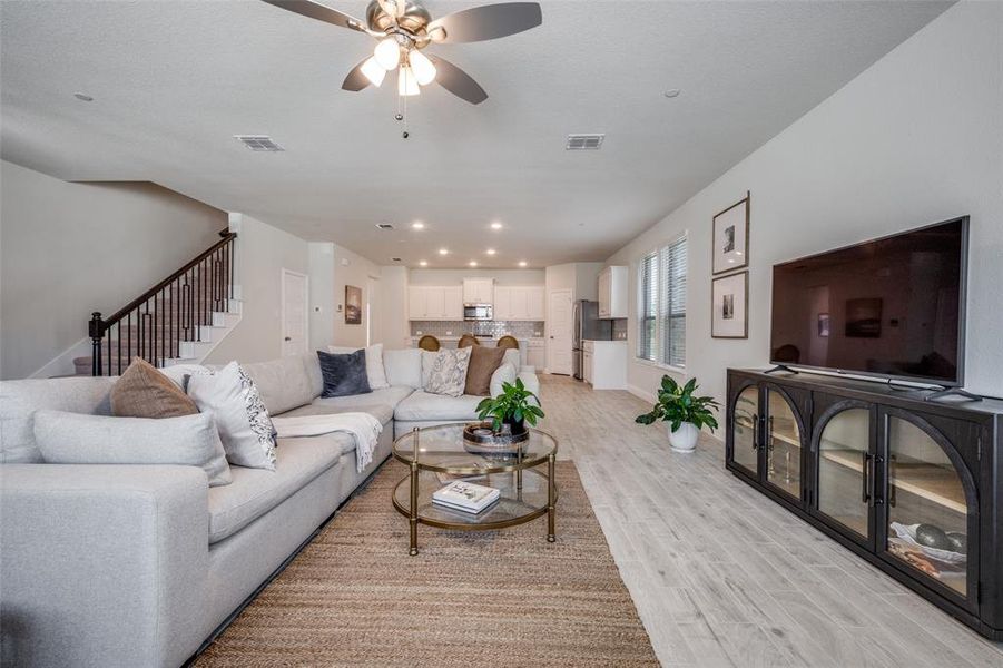 Wide open layout anchored by a spacious living area.