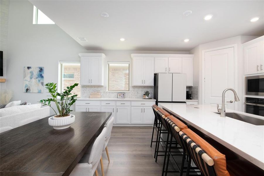 Whether hosting a crowd or enjoying a quiet evening at home, the open floor plan offers exceptional flow between the kitchen, dining, and living spaces. Whether hosting a crowd or enjoying a quiet evening at home, the open floor plan offers exceptional flow between the kitchen, dining, and living spaces.