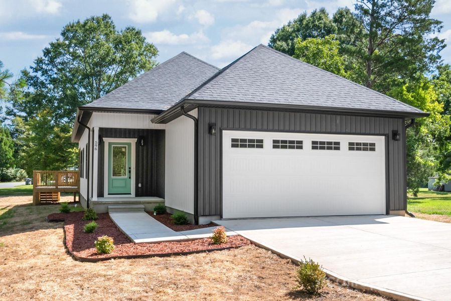 Front exterior of a new home in , Concord, NC, highlighting curb appeal (Image 18). Front exterior of a new home in , Concord, NC, highlighting curb appeal (Image 18).