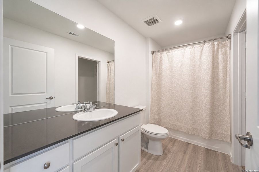 Furnished interior view inside a new home in Mission del Lago, San Antonio (Image 13).