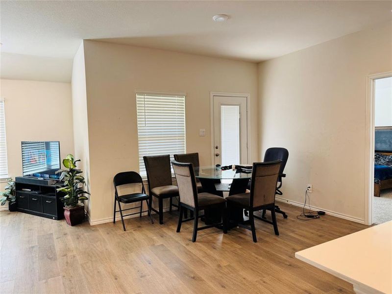 Dining area with light wood finished floors and baseboards Dining area with light wood finished floors and baseboards
