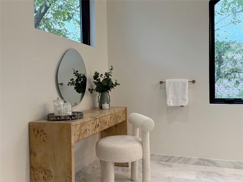 Contemporary interior with white walls and light-toned marble-finish flooring