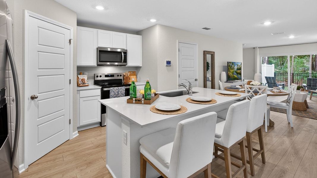 Representative furnished interior of a home built from the Greyson II by D.R. Horton in Irongate Villas, Jacksonville (Image 5).