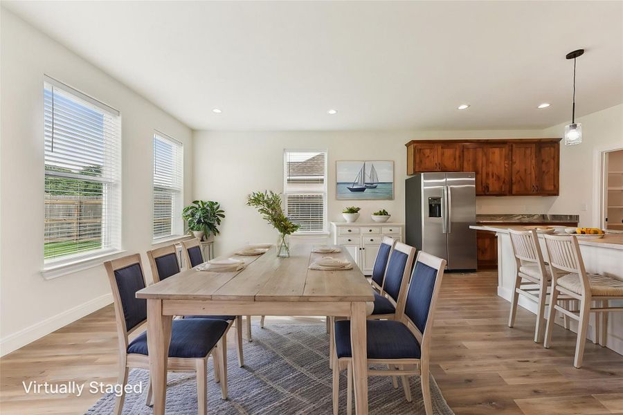 Virtually Staged Dining room featuring recessed lighting, light wood-type flooring, and baseboards Virtually Staged Dining room featuring recessed lighting, light wood-type flooring, and baseboards