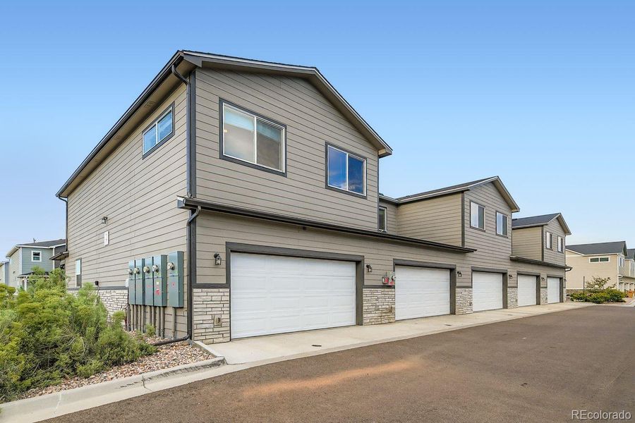Front exterior of a new home in , Fort Lupton, CO, highlighting curb appeal (Image 1).
